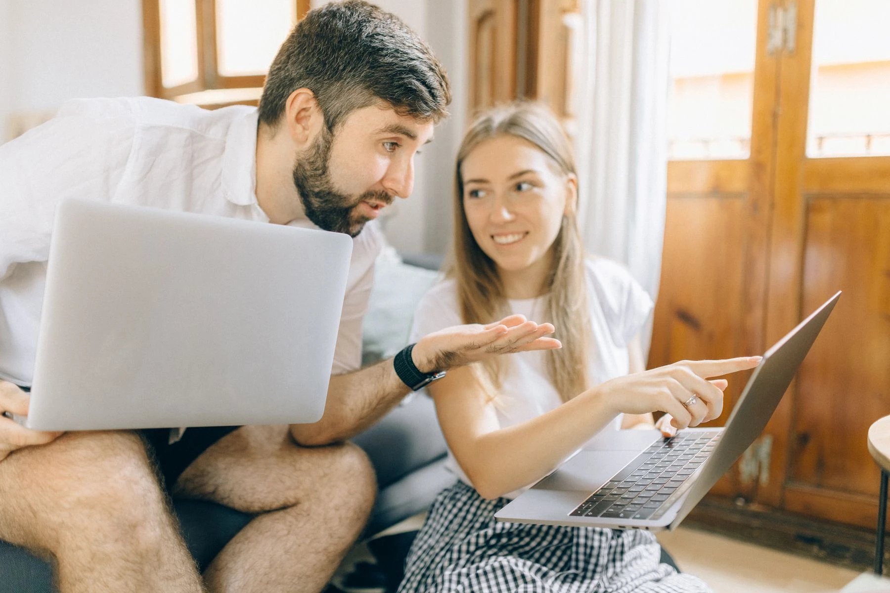 Couple looking at information on a laptop